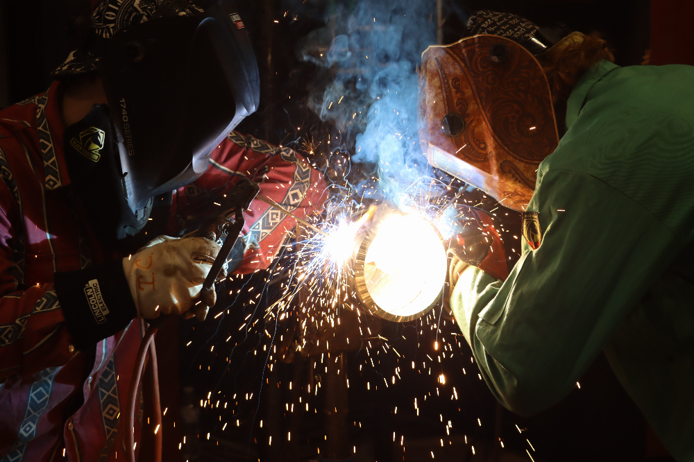 An Image of Students Welding